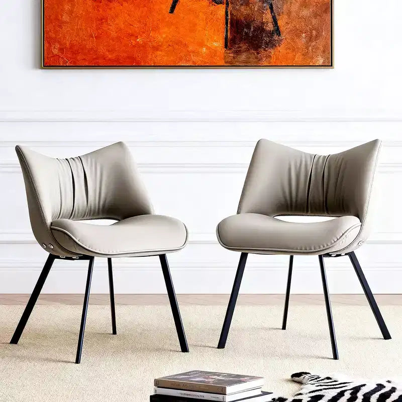 Chaise de salle à manger chic et moderne, rembourrée, avec dossier incurvé et pieds en métal noir - Gris clair