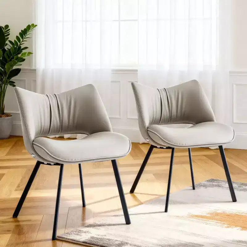 Chaise de salle à manger chic et moderne, rembourrée, avec dossier incurvé et pieds en métal noir - Gris clair