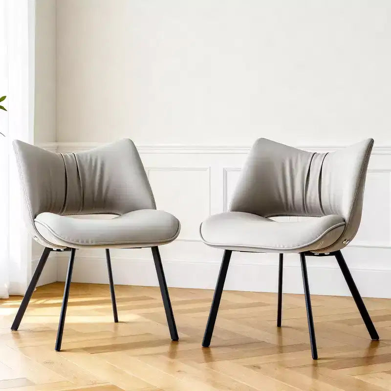 Chaise de salle à manger chic et moderne, rembourrée, avec dossier incurvé et pieds en métal noir - Gris clair